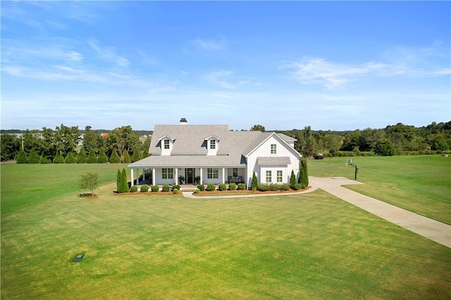 view of front of home featuring a front lawn and a porch