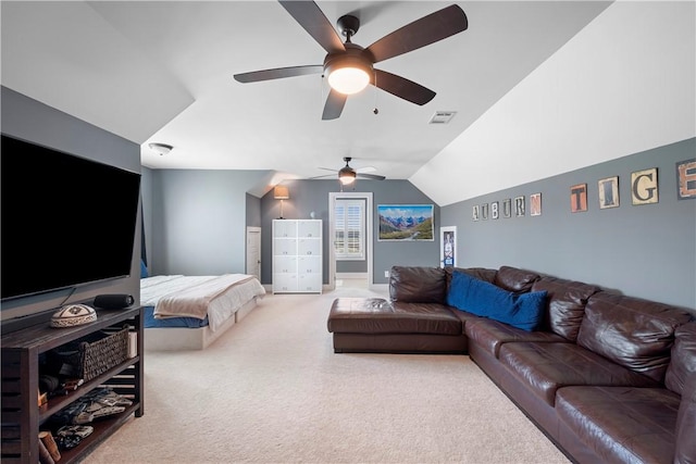 carpeted bedroom with ceiling fan and lofted ceiling