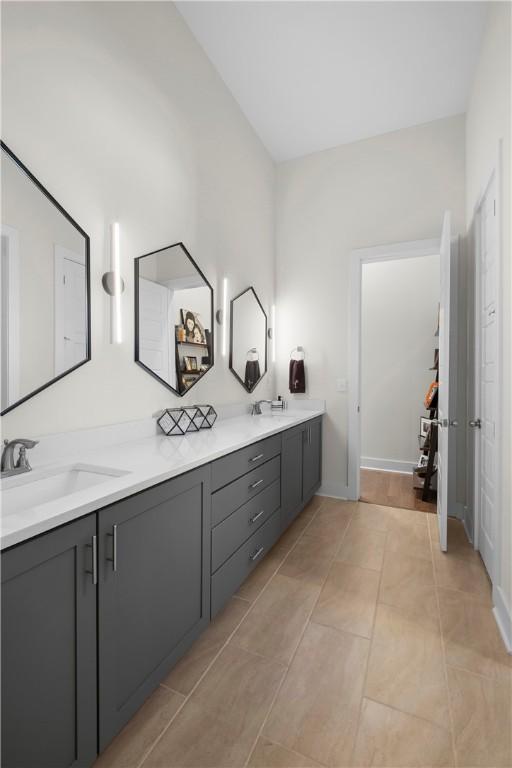 bathroom featuring tile patterned flooring and vanity