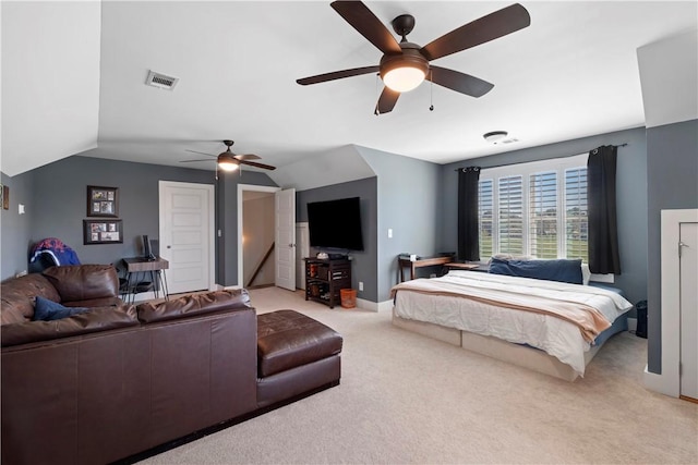 bedroom with light carpet, vaulted ceiling, and ceiling fan