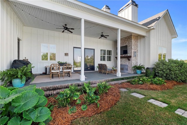 rear view of property featuring ceiling fan