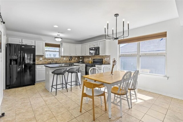 dining area featuring visible vents, recessed lighting, light tile patterned floors, baseboards, and a chandelier