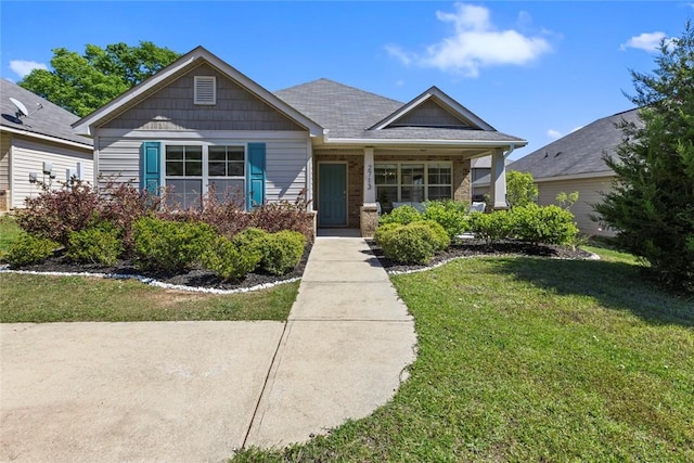 craftsman-style home with a front yard