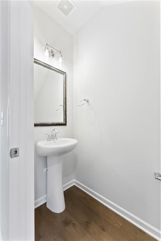 bathroom featuring sink and hardwood / wood-style flooring