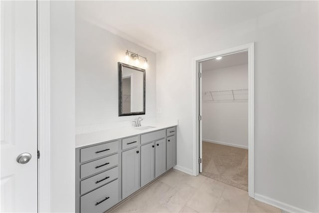 bathroom with tile patterned floors and vanity