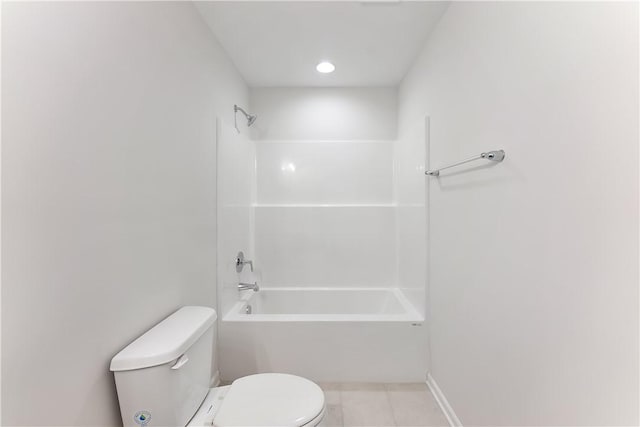 bathroom featuring toilet, shower / bath combination, and tile patterned floors