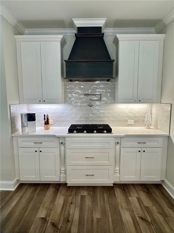 bar with white cabinets, decorative backsplash, premium range hood, and dark wood-type flooring