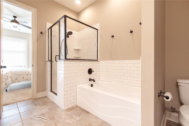 bathroom with tile patterned flooring, separate shower and tub, toilet, and ceiling fan