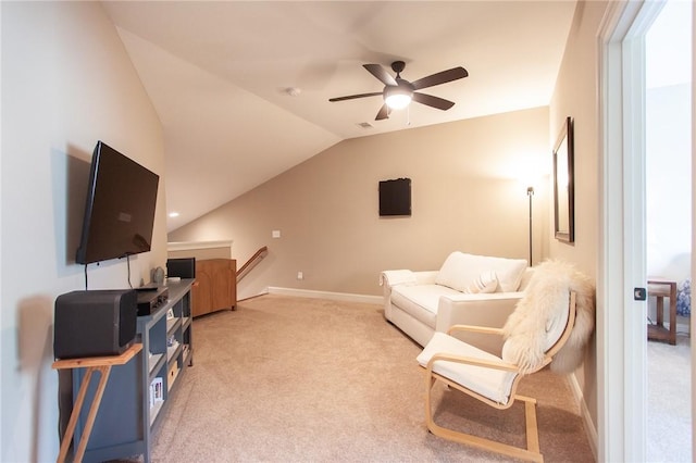 living area with light colored carpet, ceiling fan, and lofted ceiling