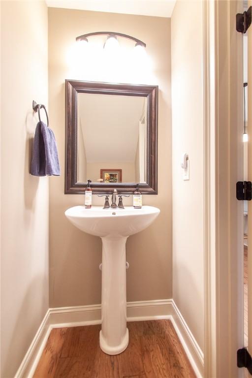 bathroom with wood-type flooring