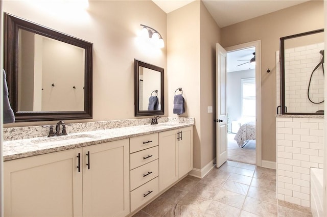 bathroom with a shower, vanity, and ceiling fan