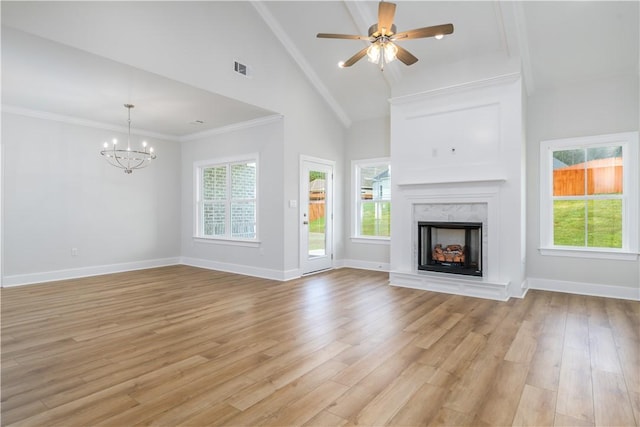 2269 Mercer Dr, Opelika, AL 36801 - unfurnished living room with light wood-style floors, a premium fireplace, a chandelier, high vaulted ceiling, and a ceiling fan