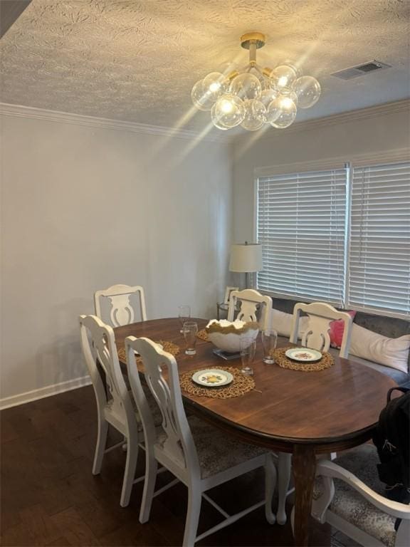 522 Oak Meadow Ln, Auburn, AL 36830 - dining space featuring a chandelier, wood finished floors, baseboards, and ornamental molding