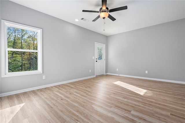 spare room featuring ceiling fan and light hardwood / wood-style floors