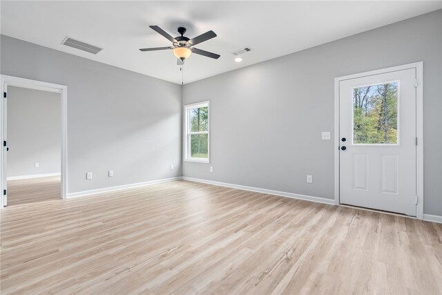 spare room featuring ceiling fan and light hardwood / wood-style flooring