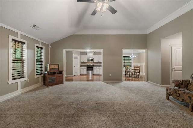 unfurnished living room with crown molding, vaulted ceiling, light colored carpet, and ceiling fan with notable chandelier