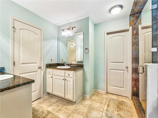 bathroom featuring vanity and walk in shower