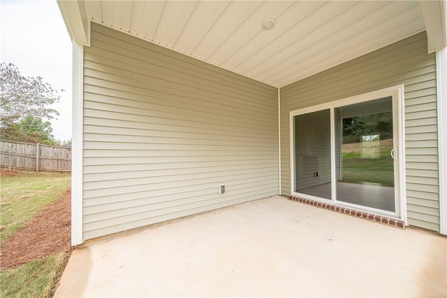 view of patio featuring fence