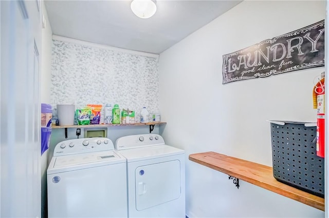 washroom featuring washing machine and dryer and laundry area