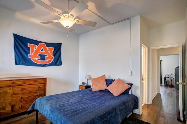 bedroom featuring dark wood-style floors and a ceiling fan