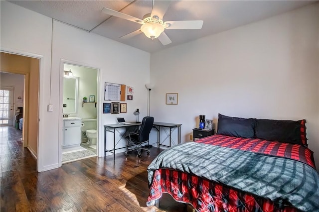 bedroom featuring a sink, ceiling fan, dark wood-type flooring, and ensuite bathroom