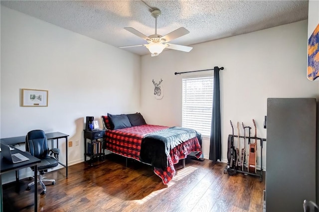 bedroom featuring baseboards, a textured ceiling, a ceiling fan, and dark wood-style flooring