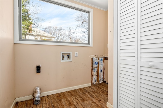 washroom featuring crown molding, hookup for a washing machine, electric dryer hookup, wood finished floors, and laundry area