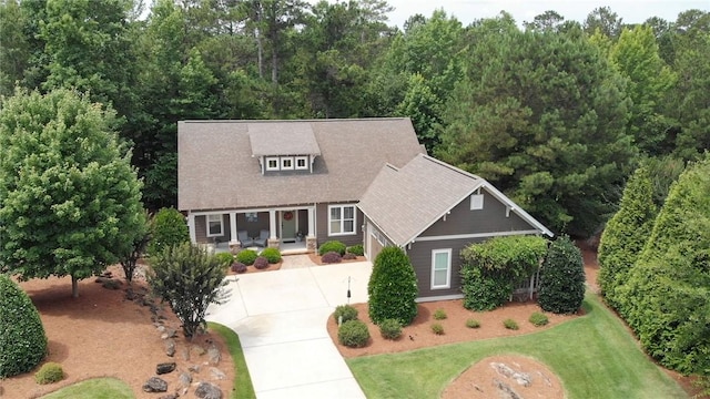3102 Quail Run, Opelika, AL 36801 - view of front of house with concrete driveway, a front lawn, and covered porch