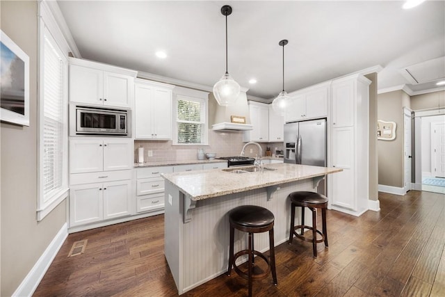 3102 Quail Run, Opelika, AL 36801 - kitchen with stainless steel appliances, white cabinets, backsplash, crown molding, and dark wood finished floors