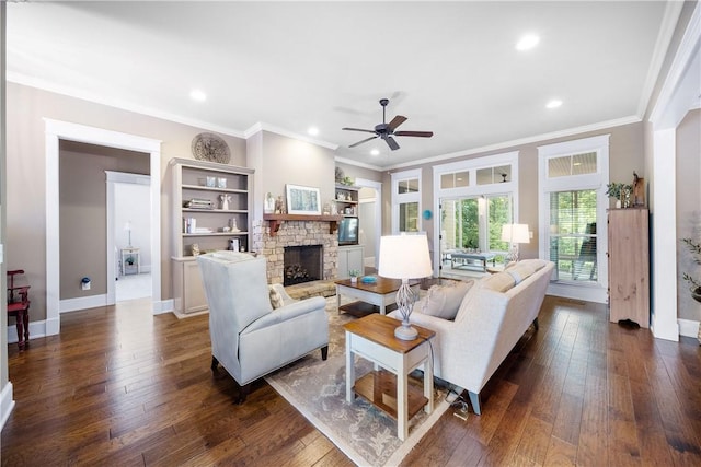 3102 Quail Run, Opelika, AL 36801 - living area featuring crown molding, ceiling fan, dark wood-style flooring, a fireplace, and recessed lighting