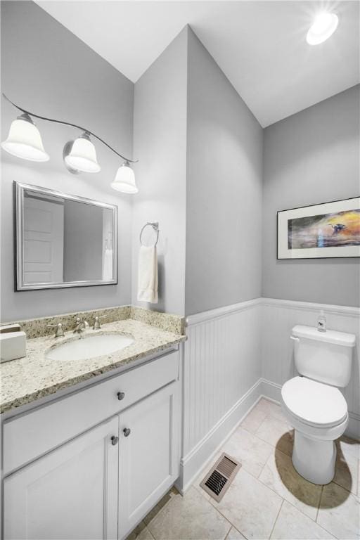 3102 Quail Run, Opelika, AL 36801 - bathroom featuring vanity, a wainscoted wall, and tile patterned floors