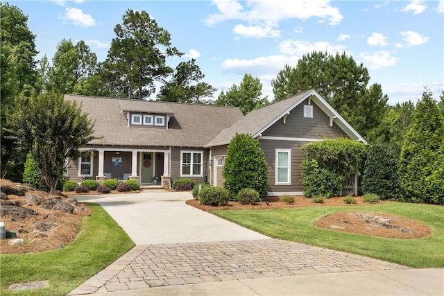 3102 Quail Run, Opelika, AL 36801 - craftsman-style house featuring driveway, a front yard, and covered porch