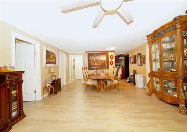 dining space featuring light wood-type flooring