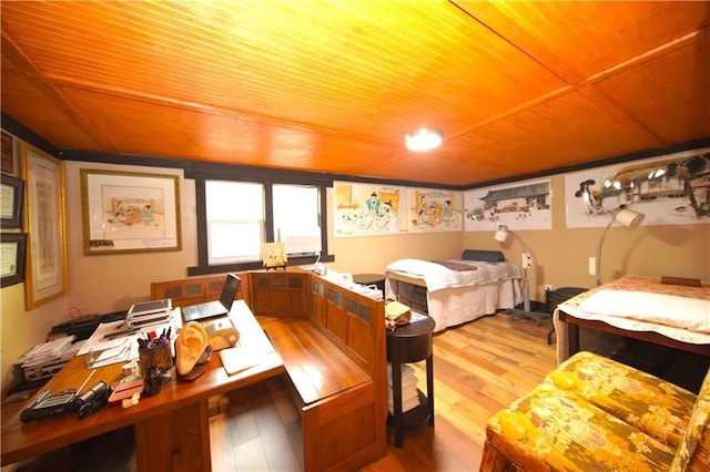 bedroom featuring light hardwood / wood-style floors and wooden ceiling