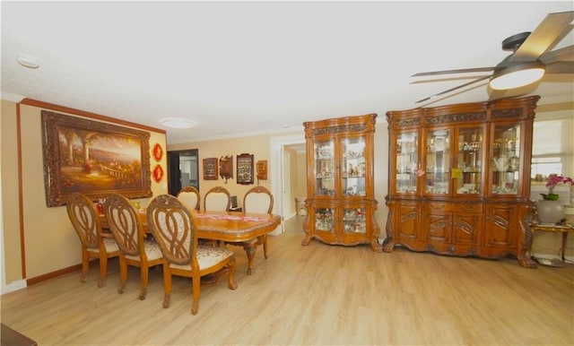 dining room with ceiling fan, light hardwood / wood-style flooring, and ornamental molding