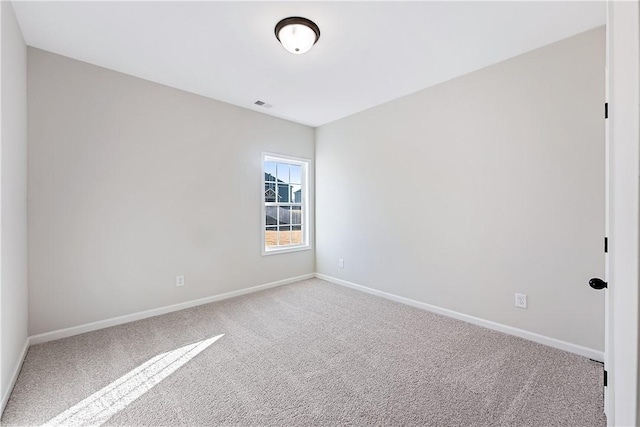 empty room with carpet flooring