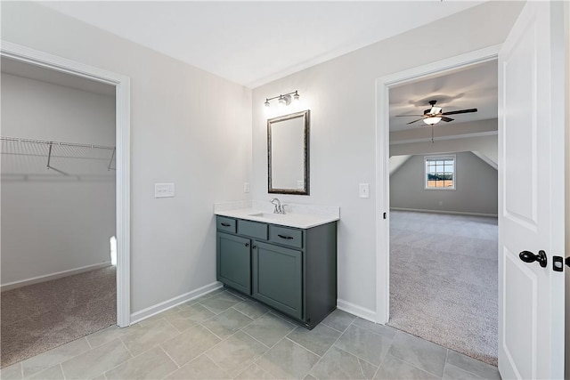 bathroom featuring ceiling fan and vanity