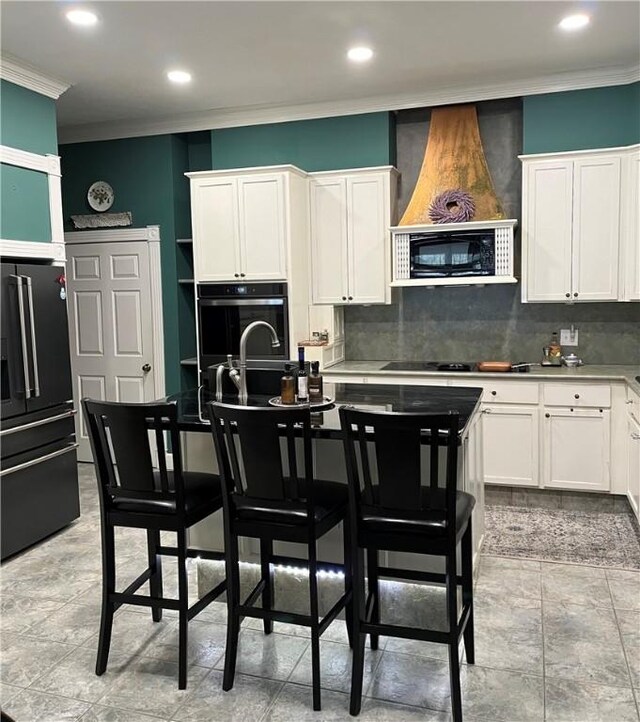 335 Forsythia Ct, Auburn, AL 36830 - kitchen with black appliances, ornamental molding, white cabinetry, decorative backsplash, and recessed lighting