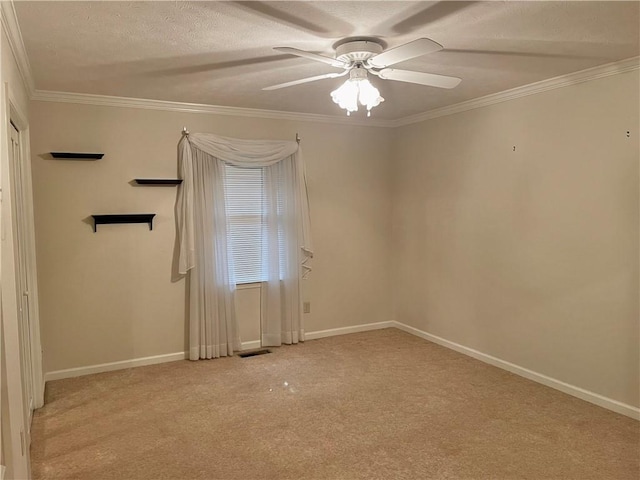 335 Forsythia Ct, Auburn, AL 36830 - unfurnished room with a ceiling fan, light carpet, ornamental molding, and a textured ceiling