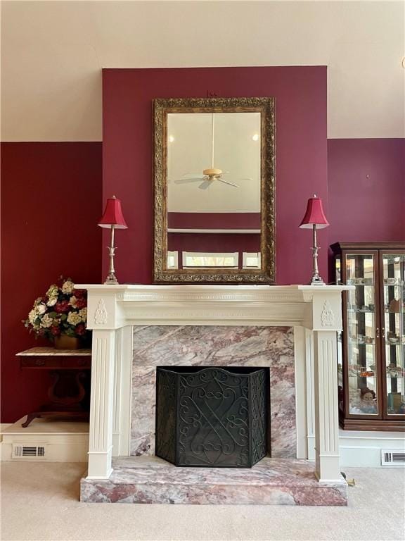 335 Forsythia Ct, Auburn, AL 36830 - detailed view of a high end fireplace, carpet, and ceiling fan