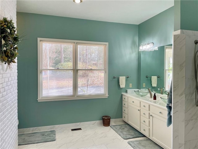 335 Forsythia Ct, Auburn, AL 36830 - full bath featuring double vanity, plenty of natural light, and marble look tiles