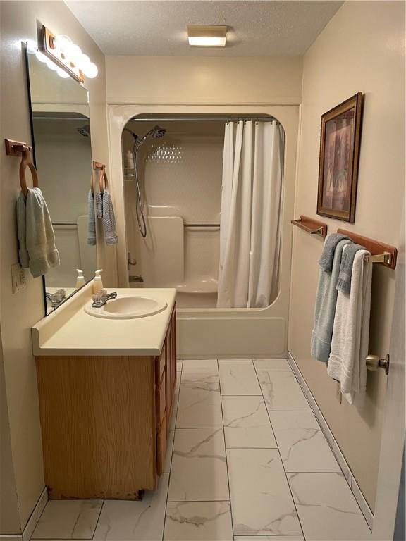 335 Forsythia Ct, Auburn, AL 36830 - bathroom with marble finish flooring, vanity, and shower / tub combo with curtain