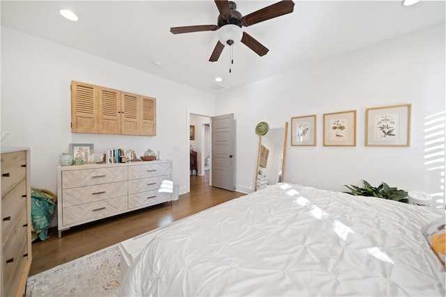 bedroom with dark wood-type flooring and ceiling fan