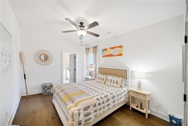 bedroom with dark hardwood / wood-style floors and ceiling fan