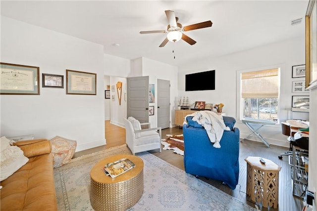 living room with hardwood / wood-style floors and ceiling fan