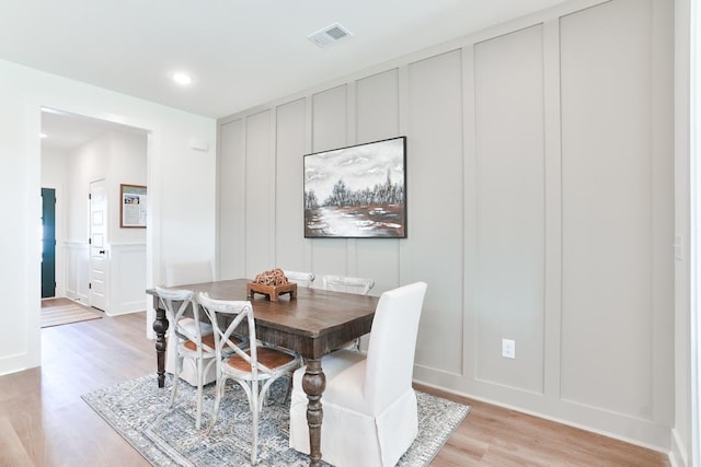 108 Hunters Way, Opelika, AL 36801 - dining area with a decorative wall, light wood finished floors, and recessed lighting