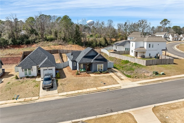 birds eye view of property with a residential view