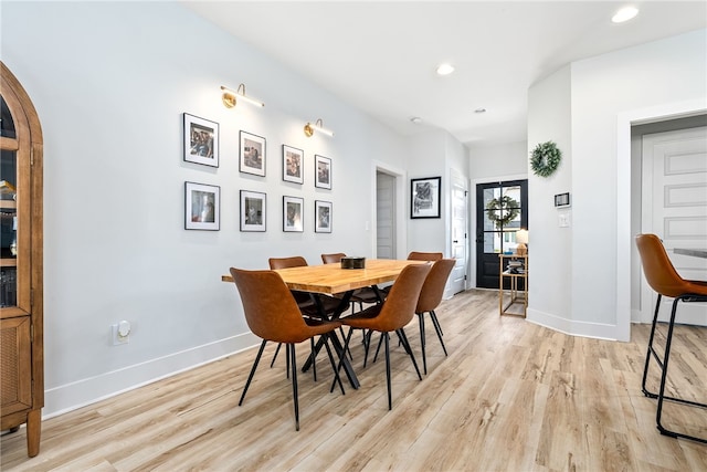 dining room featuring recessed lighting, light wood-type flooring, and baseboards