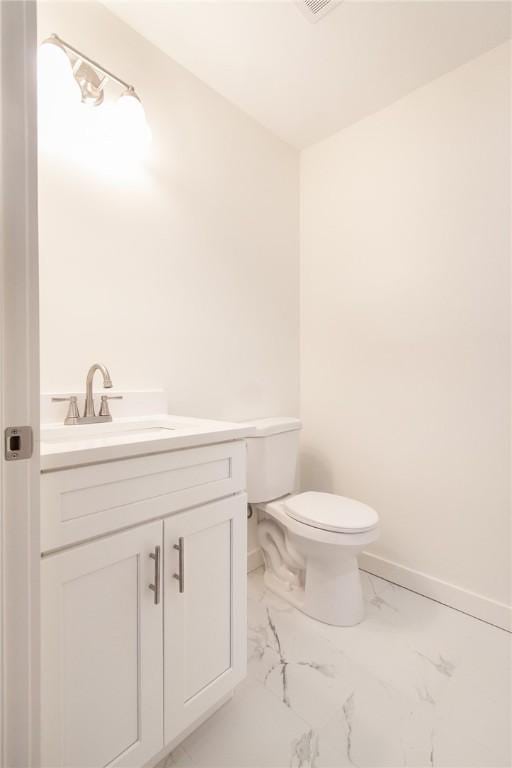 762 Lee Road 197, Phenix City, AL 36870 - half bath with vanity, toilet, baseboards, and marble finish floor