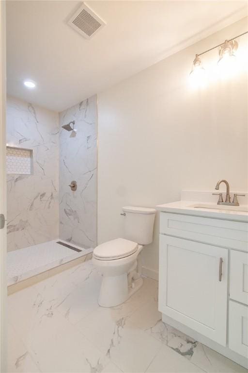 762 Lee Road 197, Phenix City, AL 36870 - bathroom with visible vents, toilet, marble finish floor, a marble finish shower, and vanity